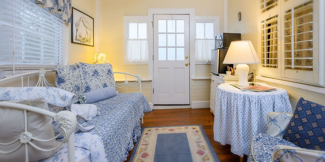 Dogwood Suite at Oakland Cottage, king bed with floral bedding
