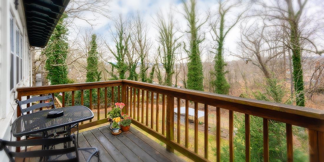 The private deck of the Garden Suite overlooking the back yard
